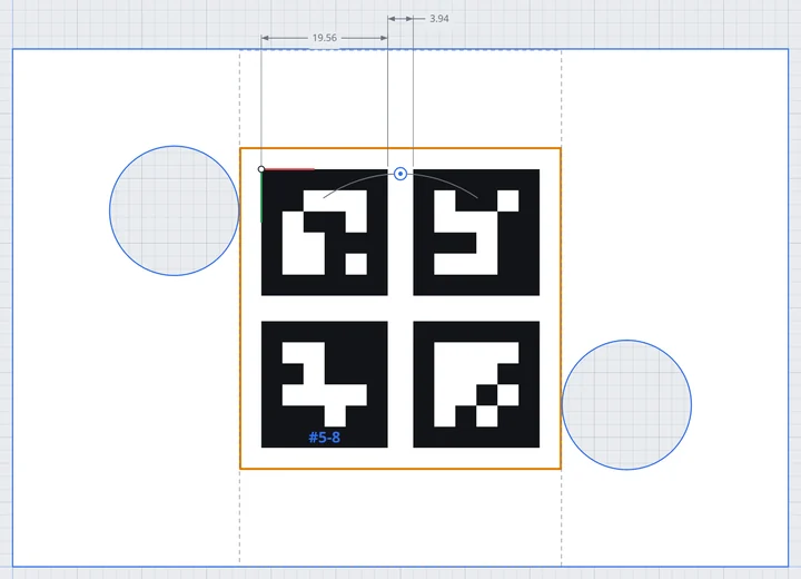 A 2 × 2 grid of ArUco markers on the plate